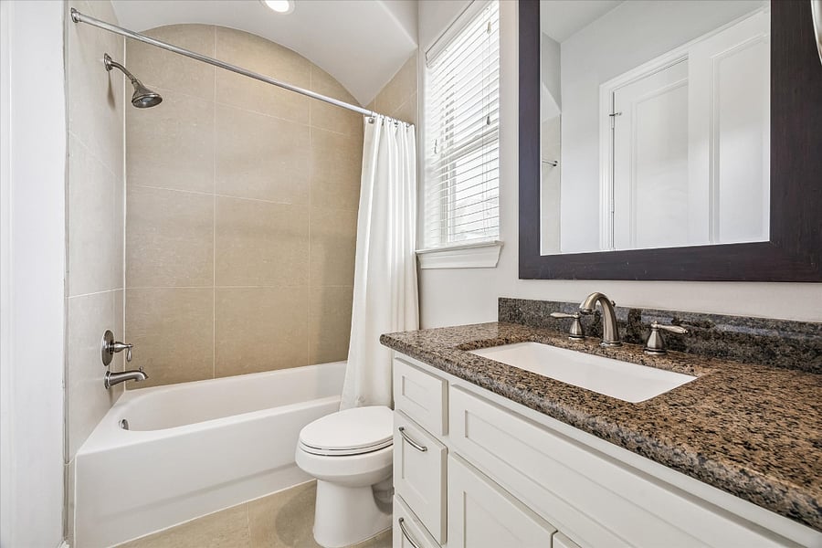 Third floor en suite bath, attached to secondary bedroom.