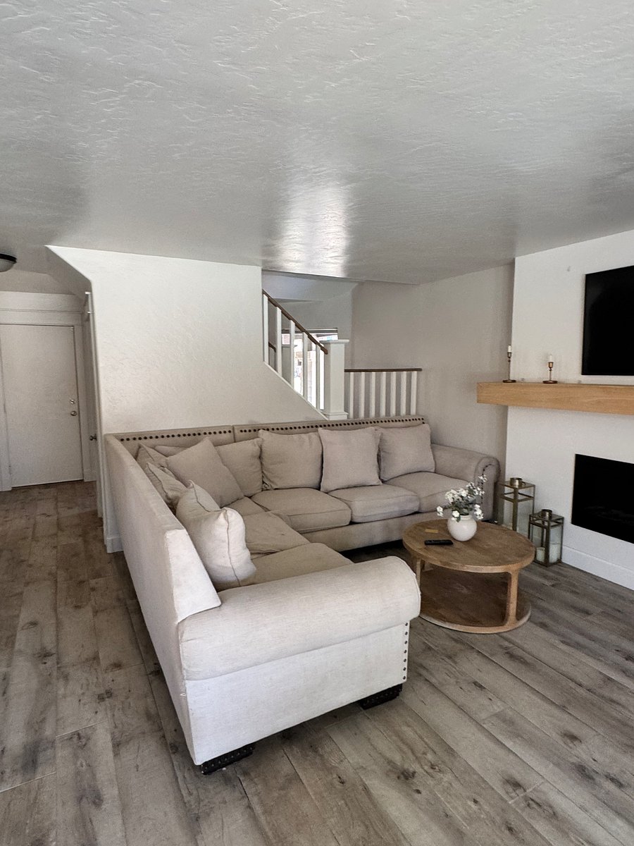 Downstairs living room next to kitchen/dinning room with TV Area