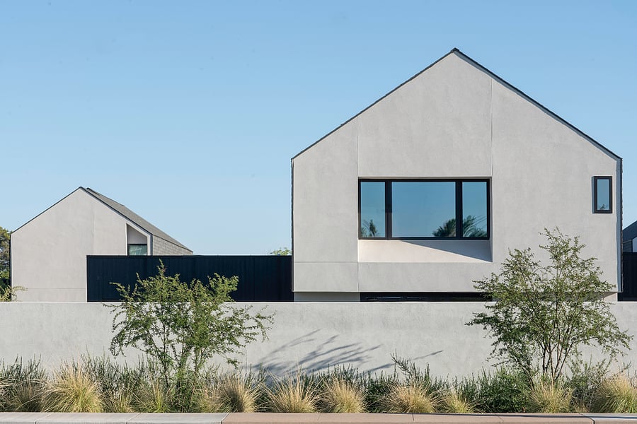 Privacy Wall to Backyard: A quiet architectural composition of simple forms, desert landscaping, and privacy walls reinforces the homes sense of retreat.