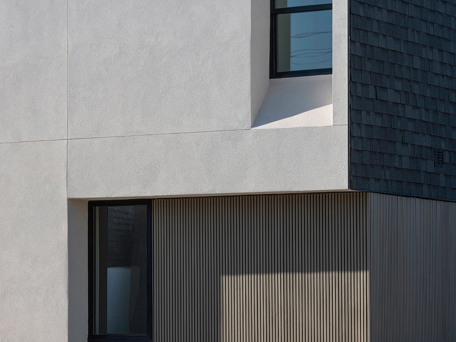 Architectural Detail / Material Palette: Durable, low-maintenance materials and warm vertical textures create a sophisticated modern exterior with lasting architectural character.