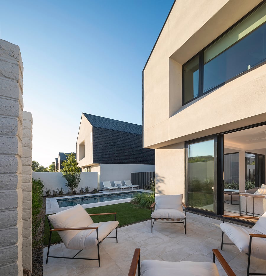 Private Pool Courtyard / Outdoor Lounge: A private heated pool courtyard with lounge seating, outdoor dining, and fire feature creates a resort-like setting for extended Phoenix stays.