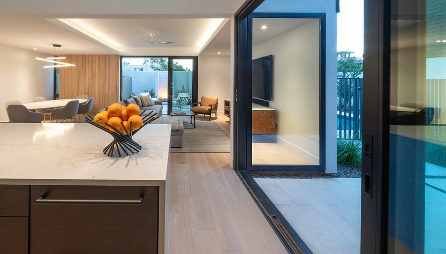 Kitchen to Living / Pool Connection: The open kitchen, dining, living, and pool areas flow together for a seamless furnished retreat designed for everyday comfort and entertaining.