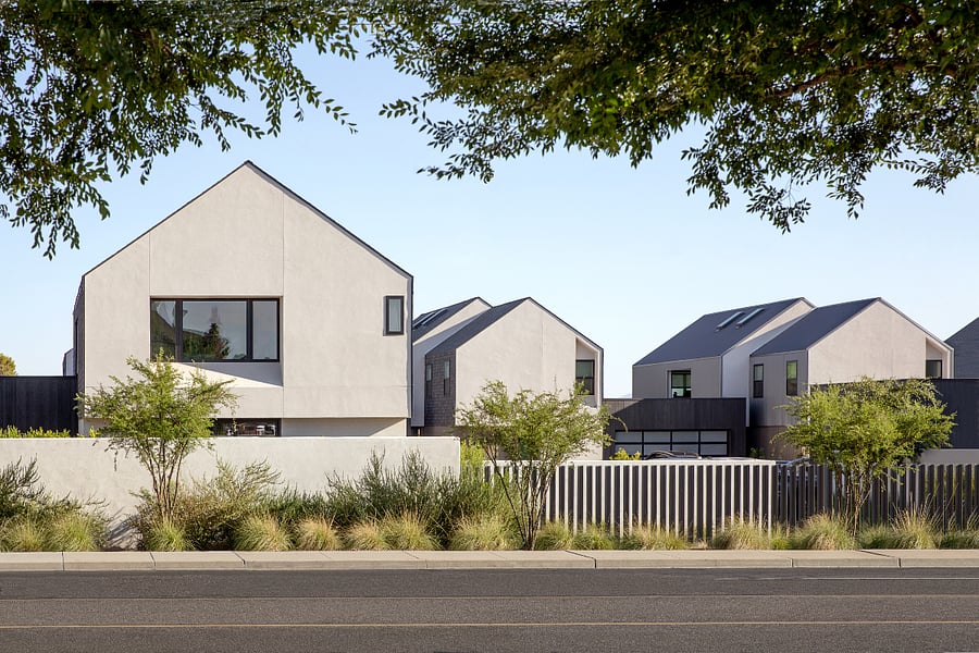 Community Edge / Privacy Wall: Clean modern forms, private outdoor courts, and low-maintenance desert planting define the quiet, design-forward character of the KARMA community.