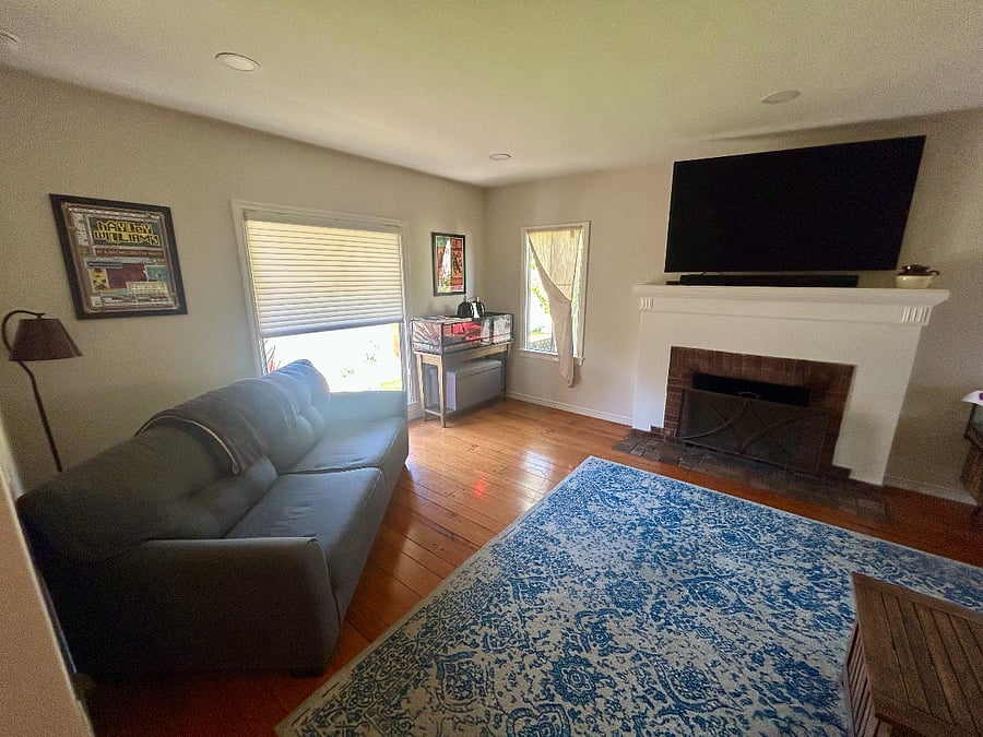 Living room with smart TV and couch.