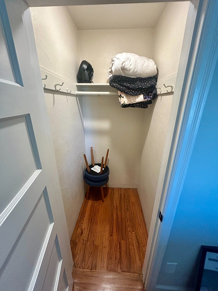 Full sized closet with extra blankets and portable fan.