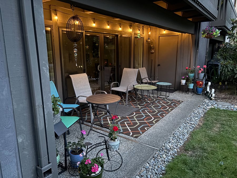 As evening falls, the patio lighting creates a warm, inviting place to unwind and enjoy the peaceful surroundings after a busy day.