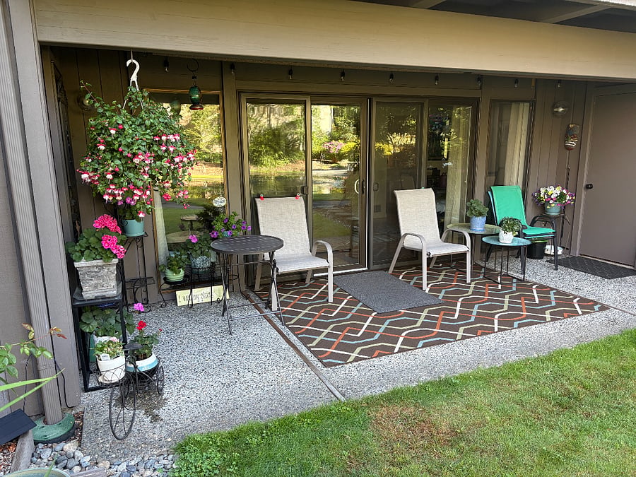 Step outside to enjoy the private patio, a peaceful spot for morning coffee, reading, or simply relaxing while overlooking the beautifully landscaped six-acre community.