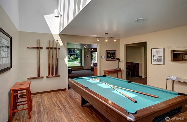 The clubhouse offers residents a comfortable place to relax and socialize, with a pool table, sauna, and seating areas to enjoy throughout the year.