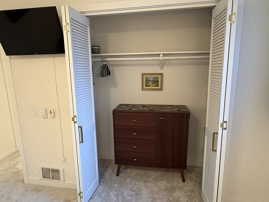 This closet is all yours. The dresser and shelf are available for your clothing and personal belongings. I'll provide a starter set of hangers, and if you need more, just let me know.