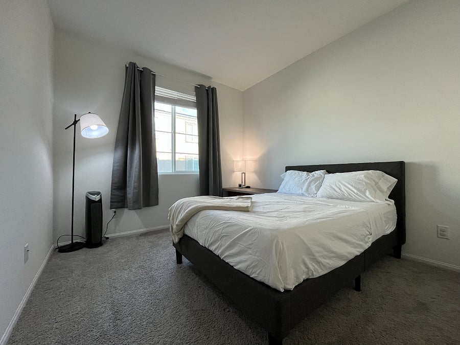 2nd bedroom with full bed, dresser, and closet