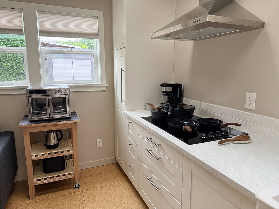 Kitchen with everything you need to cook homemade meals. Including: convection oven w/air fryer, electric cooktop, toaster, electric kettle, coffee maker.