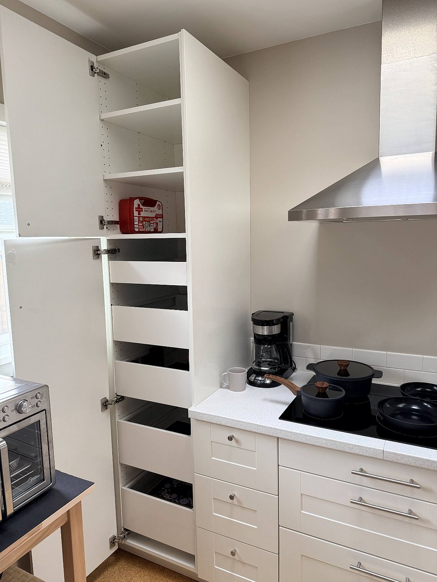 Ample storage in kitchen with pull out drawers and deep shelves.