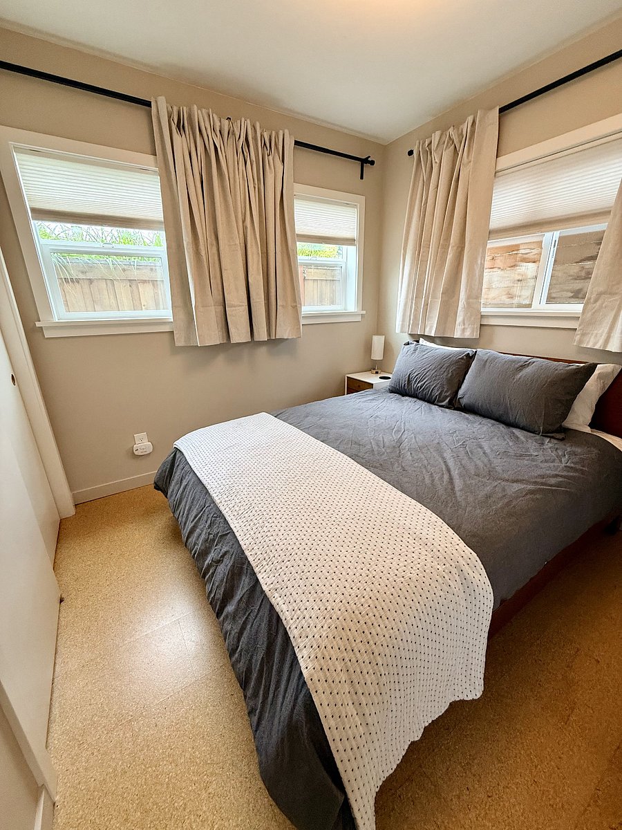 Comfy queen bed with brand new duvet and linens. Windows have pull-down shades as well as blackout curtains for your best night sleep!