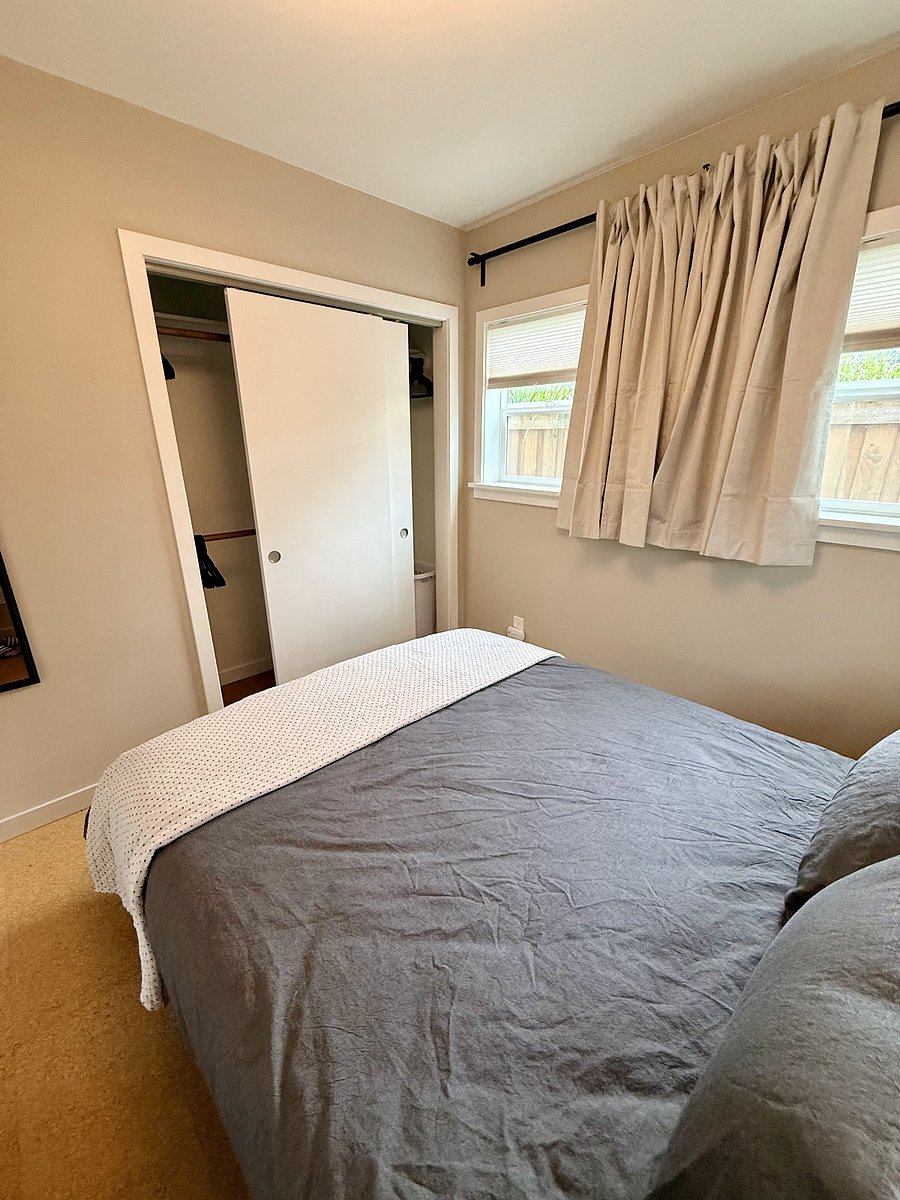 Separate closet with 3 hanging rods and shelves for extra storage.