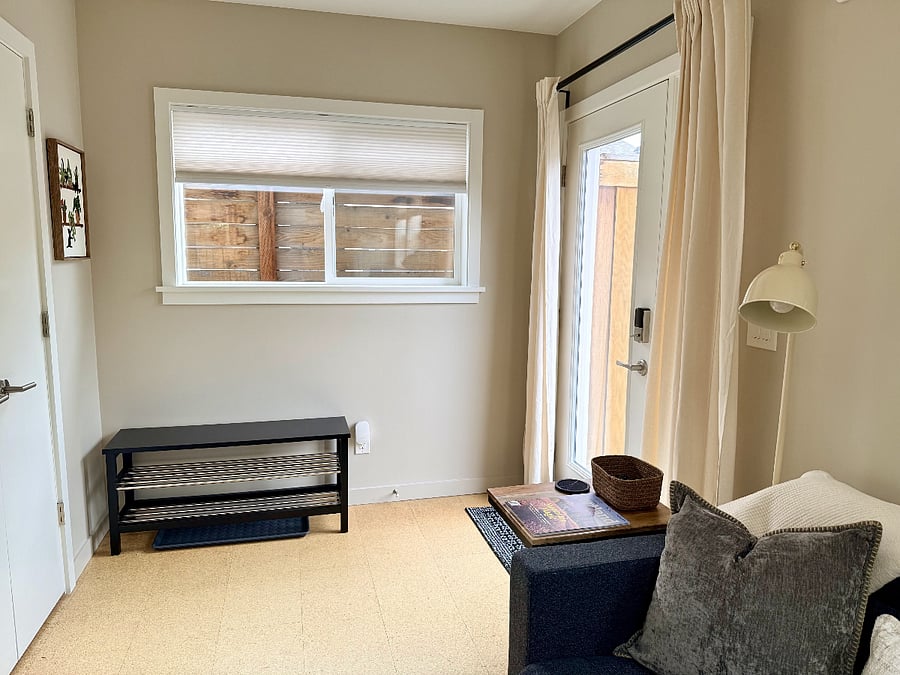 Entryway with bench and shoe storage.