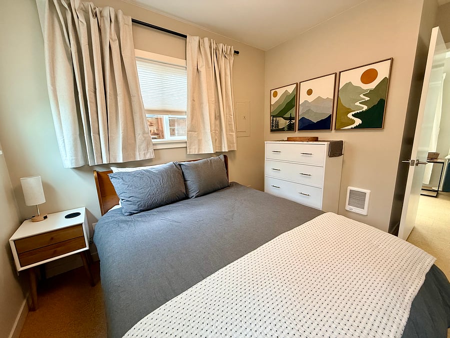Large dresser, queen bed, and stylish nightstand w/lamp