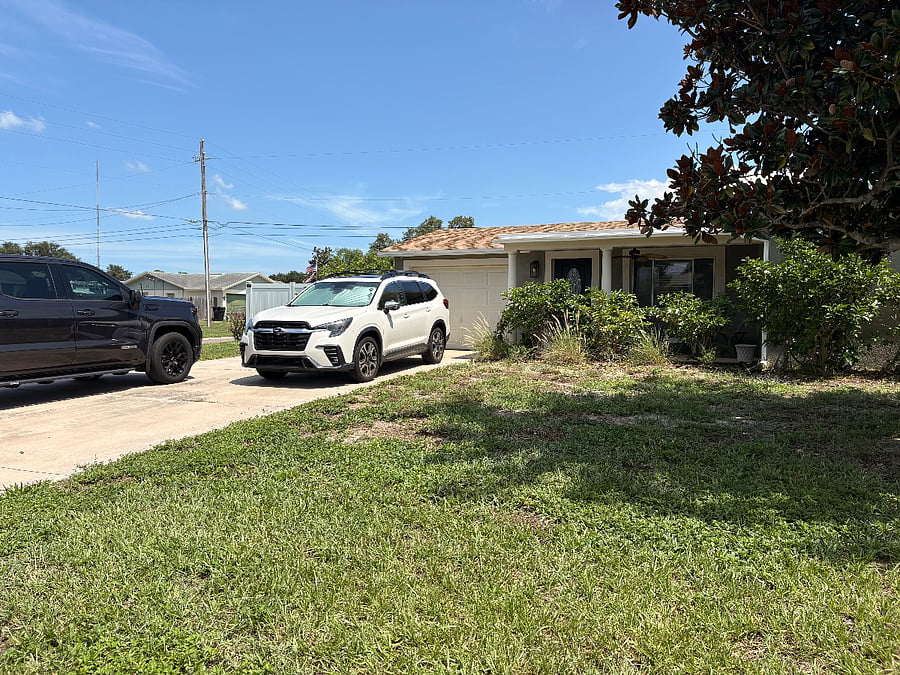 1-Car garage and large driveway that comfortable fits four vehicles. Corner property with large front yard. 