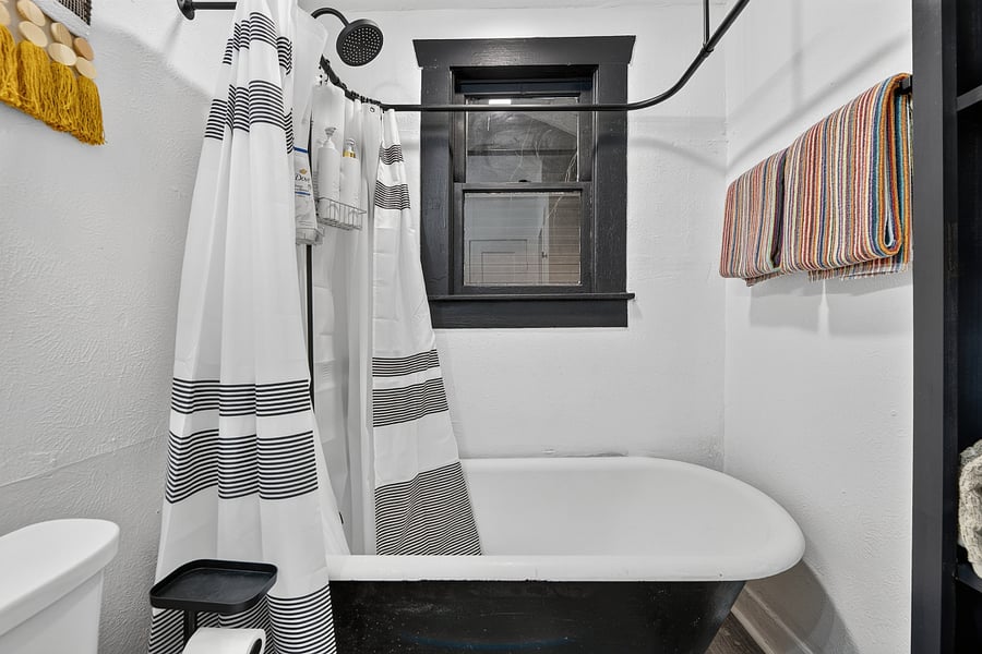 Full bathroom with clawfoot tub