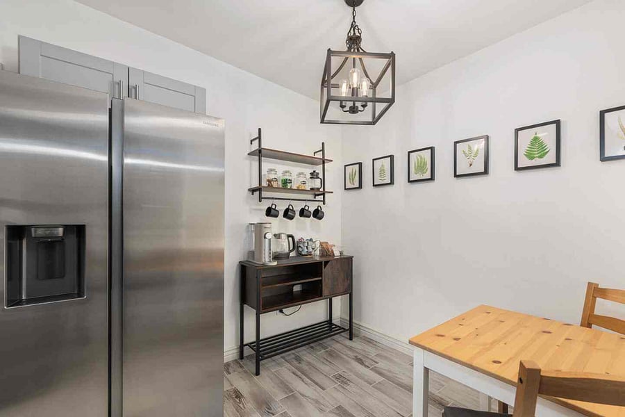 Fridge, breakfast bar, and dining table