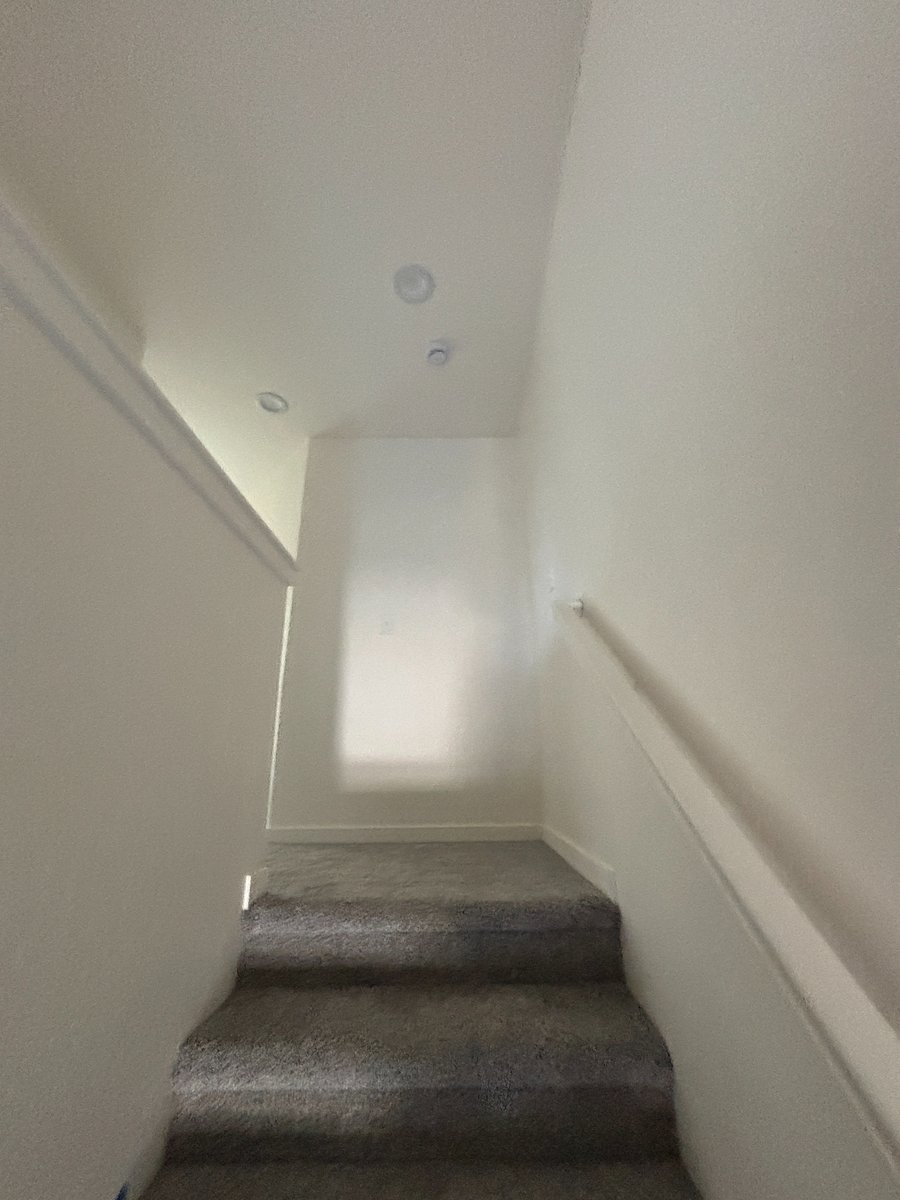 Main floor stairs to 3 bedrooms, laundry, and two bathrooms,. 