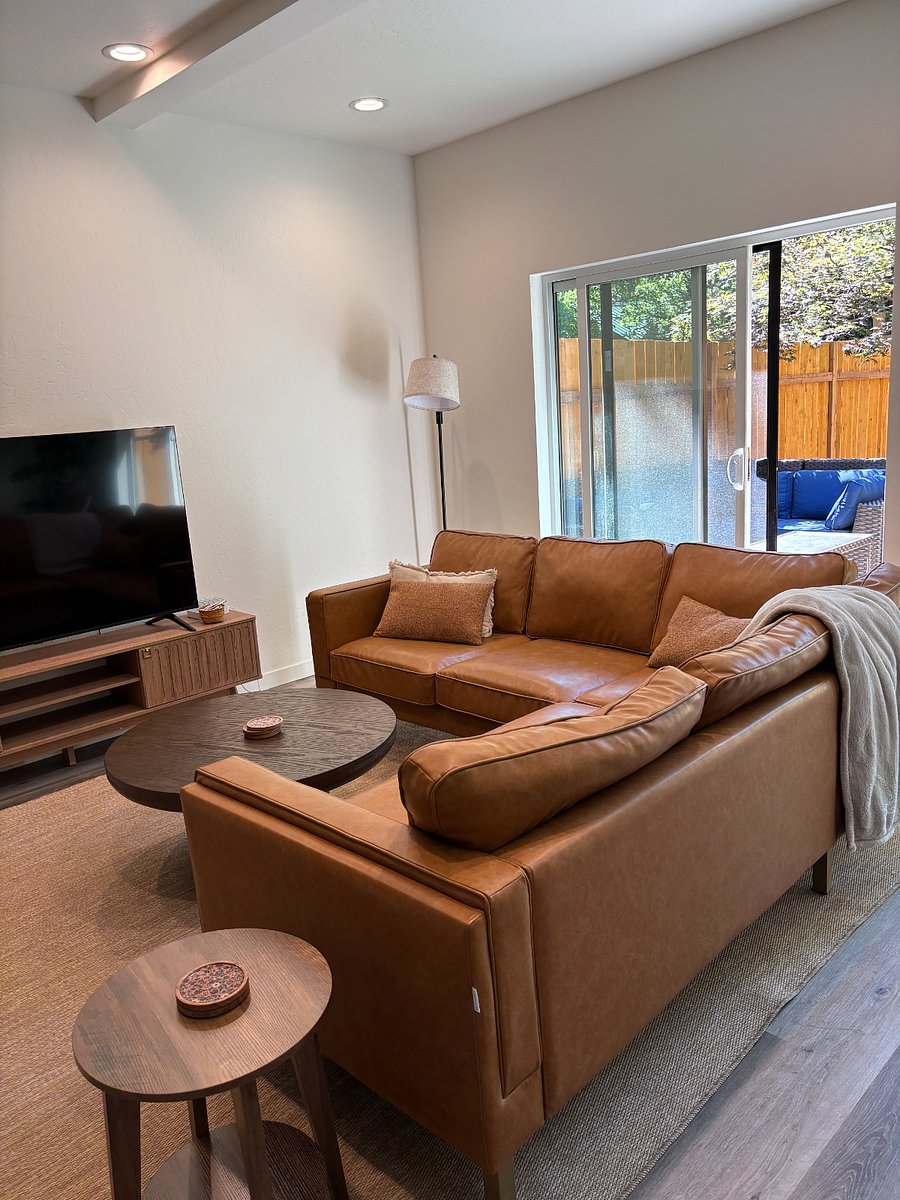 family room with peak outback to a fenced area surrounded by 50-100 year old Japanese maples and other rare indigenous plants.
