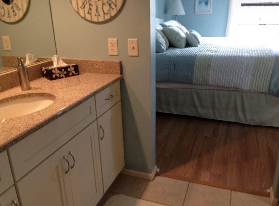 Master bedroom sink. Large walk in closet across from sink and toilet and shower.