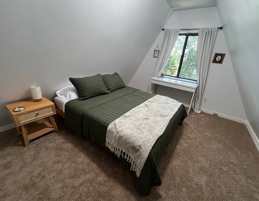 Upstairs second bedroom with queen bed and desk