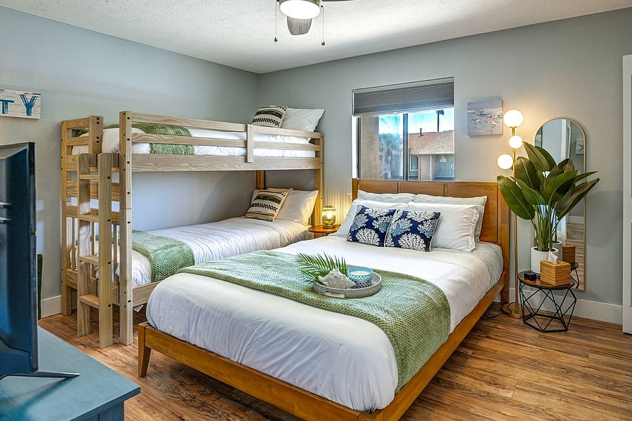 Queen primary bedroom w/twin bunks.