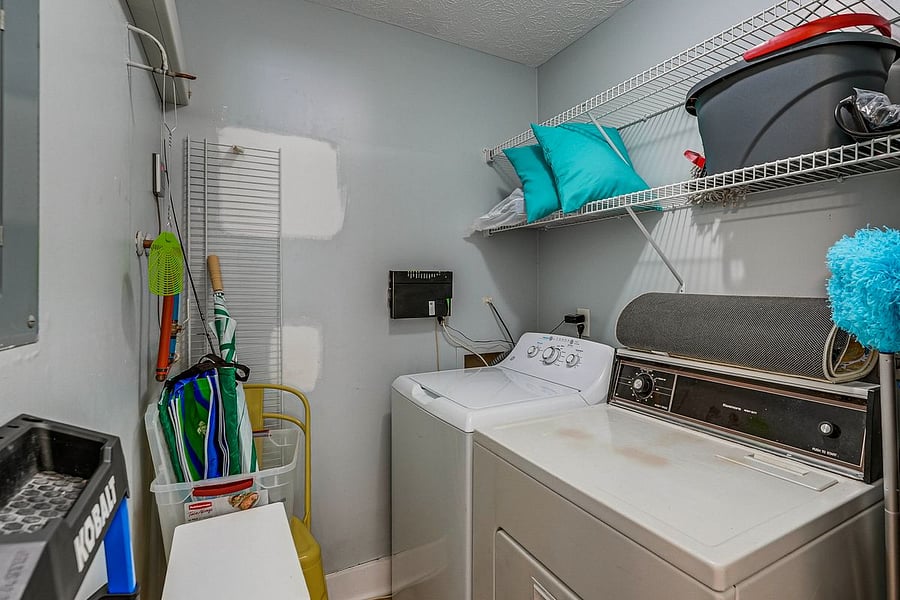Utility room with washer and dryer