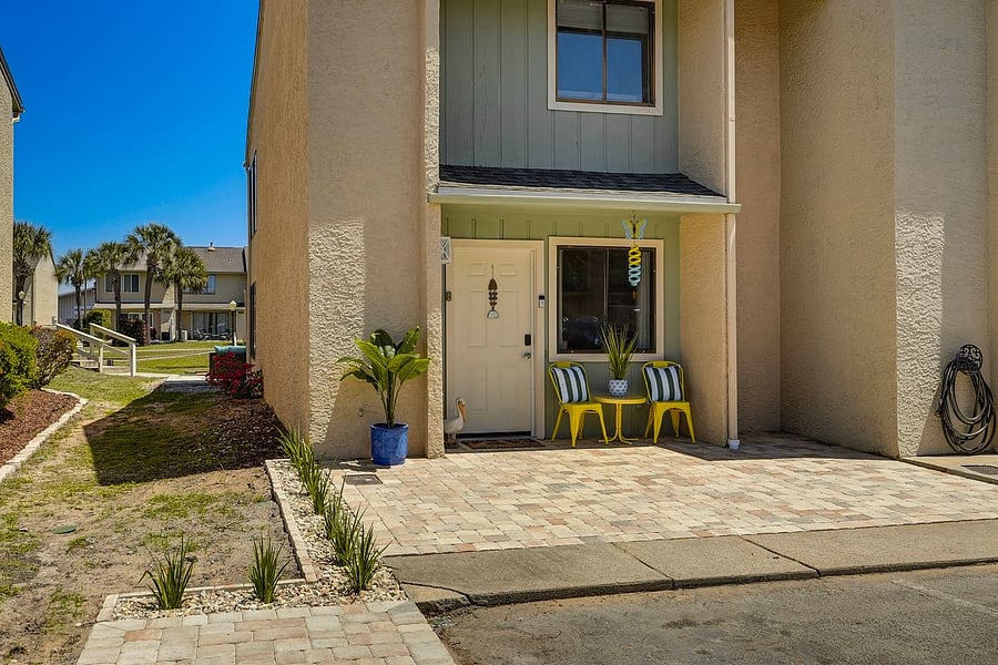 Front with 2 parking spaces for car and 1 golf cart space.