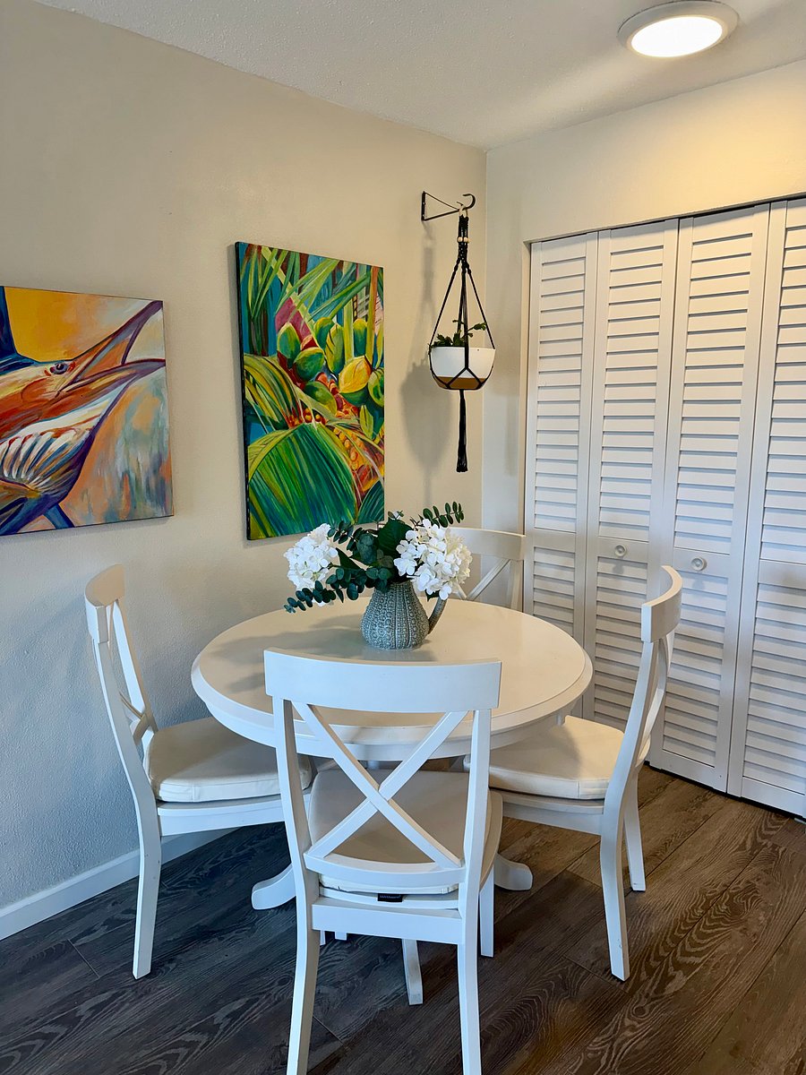 Wooden Dining Table and Chairs with Oversized Pantry in Background