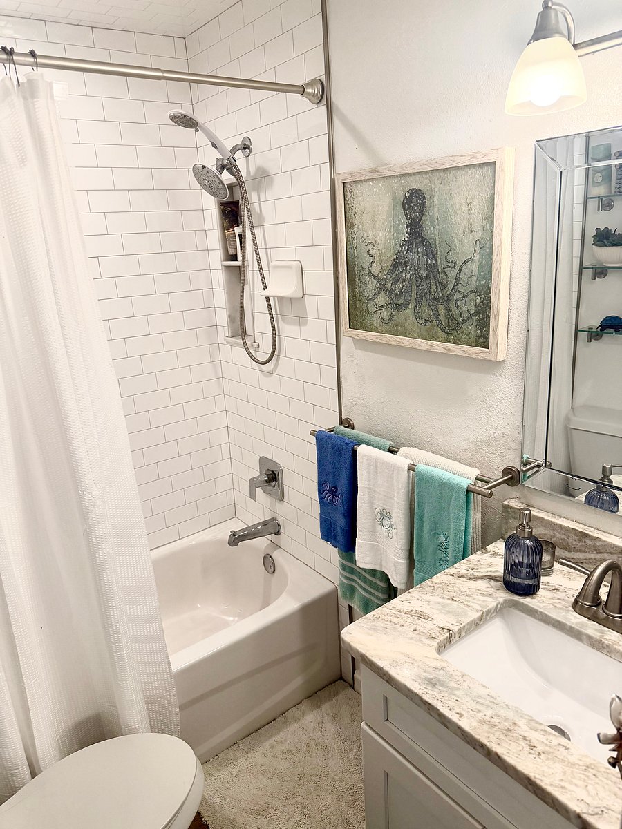 Bright Bathroom with Subway Tile Shower