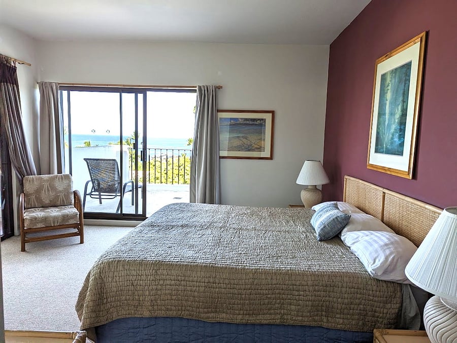 Master bedroom with sliding doors to Lanai and Sun Deck