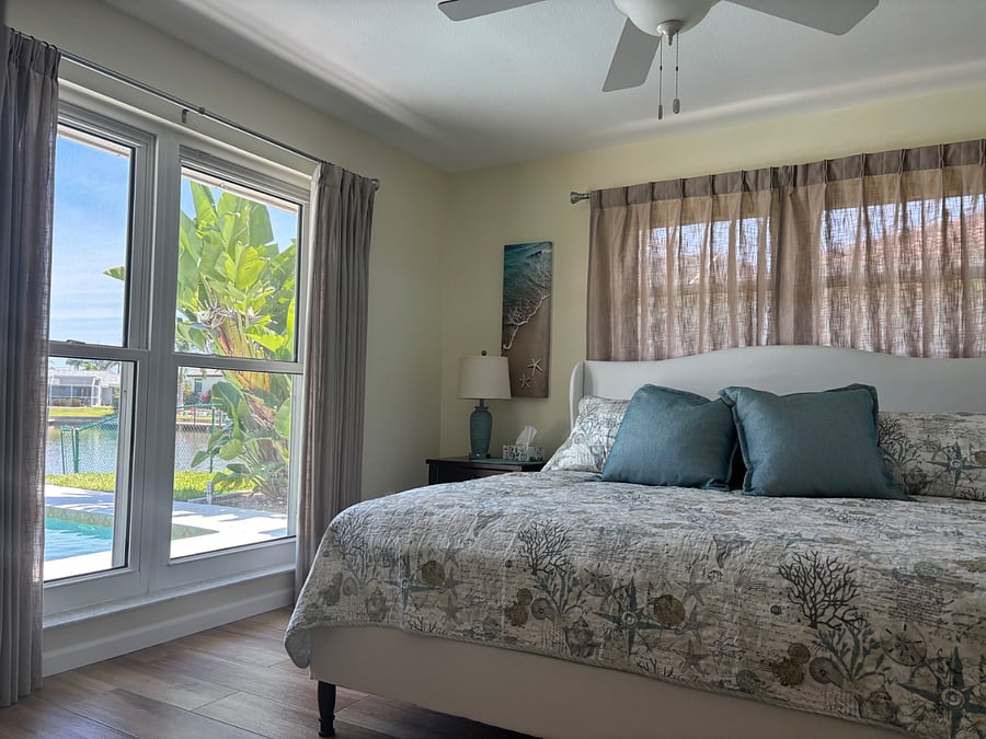 Bedroom with King Bed, dresser, large closet and smart T.V.