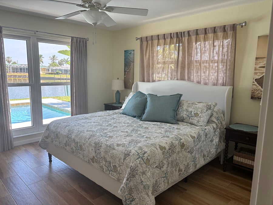 Bedroom with King Bed, dresser, large closet and smart T.V.