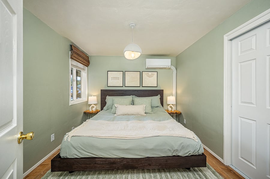 King-sized bed. Full closet with sliding door that includes hanging space, upper shelf, and drawer space. There is a standing mirror within this room as well as a 5-drawer dresser.