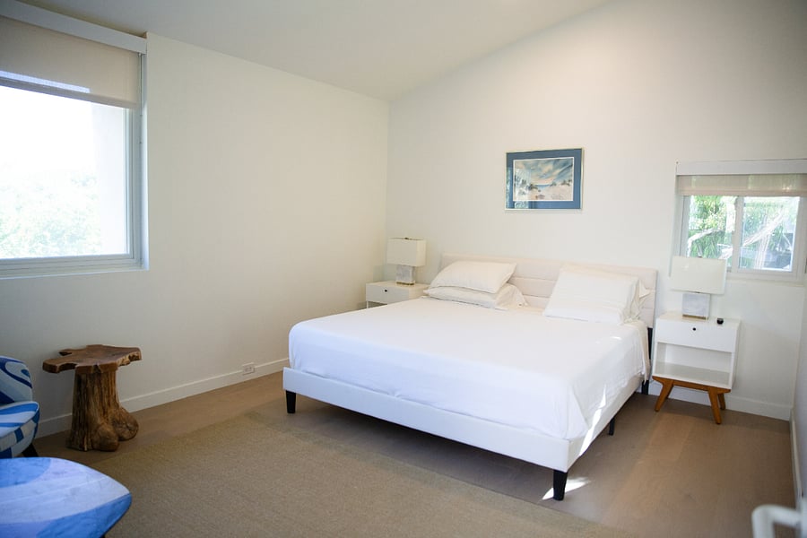 en-suite bedroom with king bed and TV