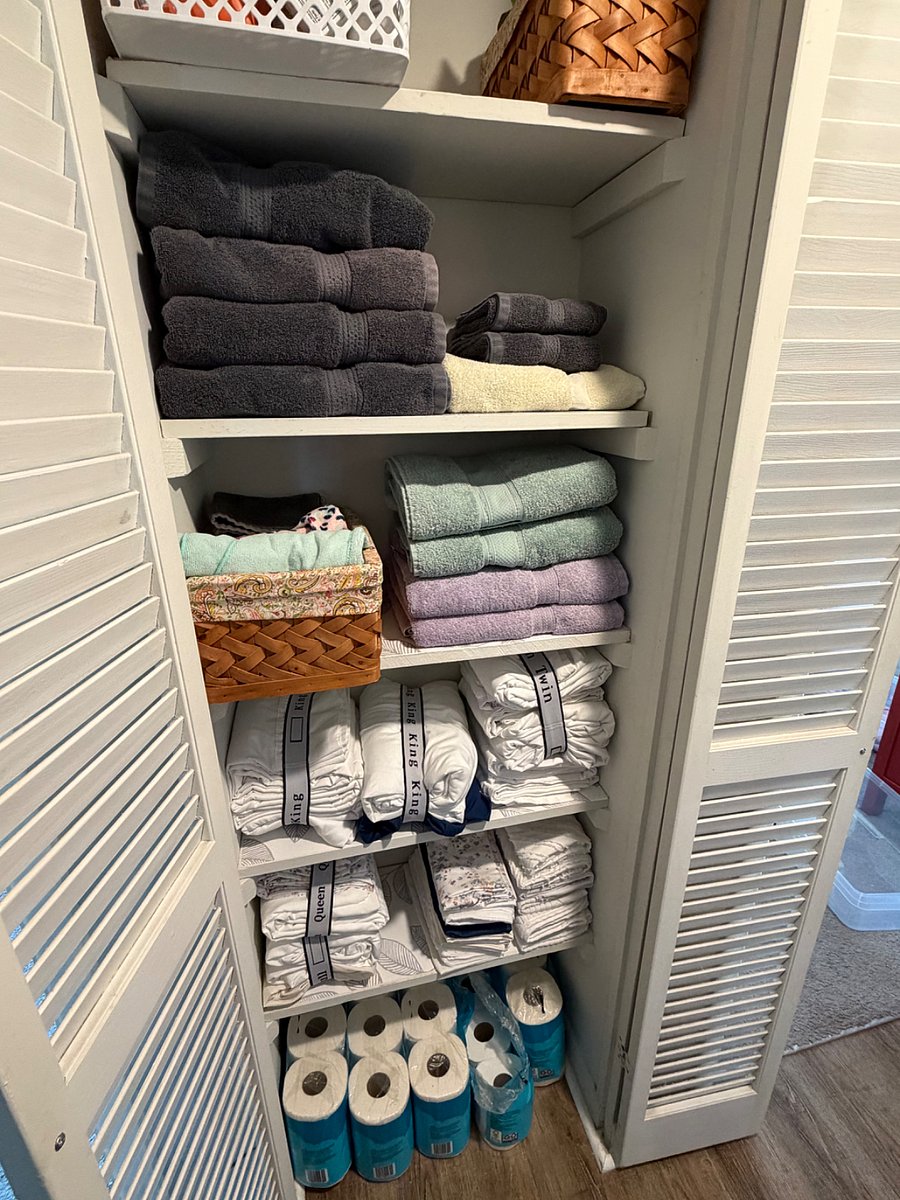 Fully stocked linen closet with back up sheets, towels, medicine, toilet paper and tissues