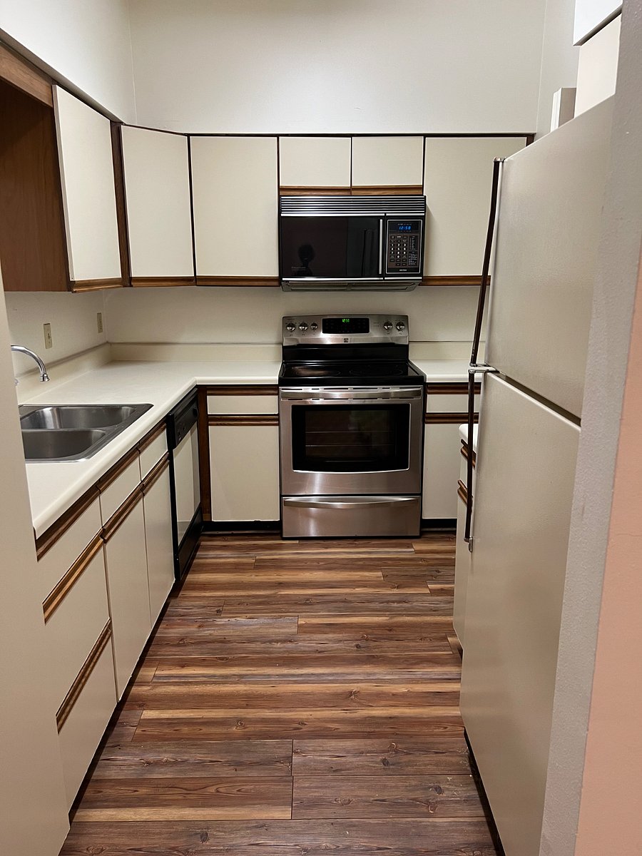 Kitchen with full sized utility room on right