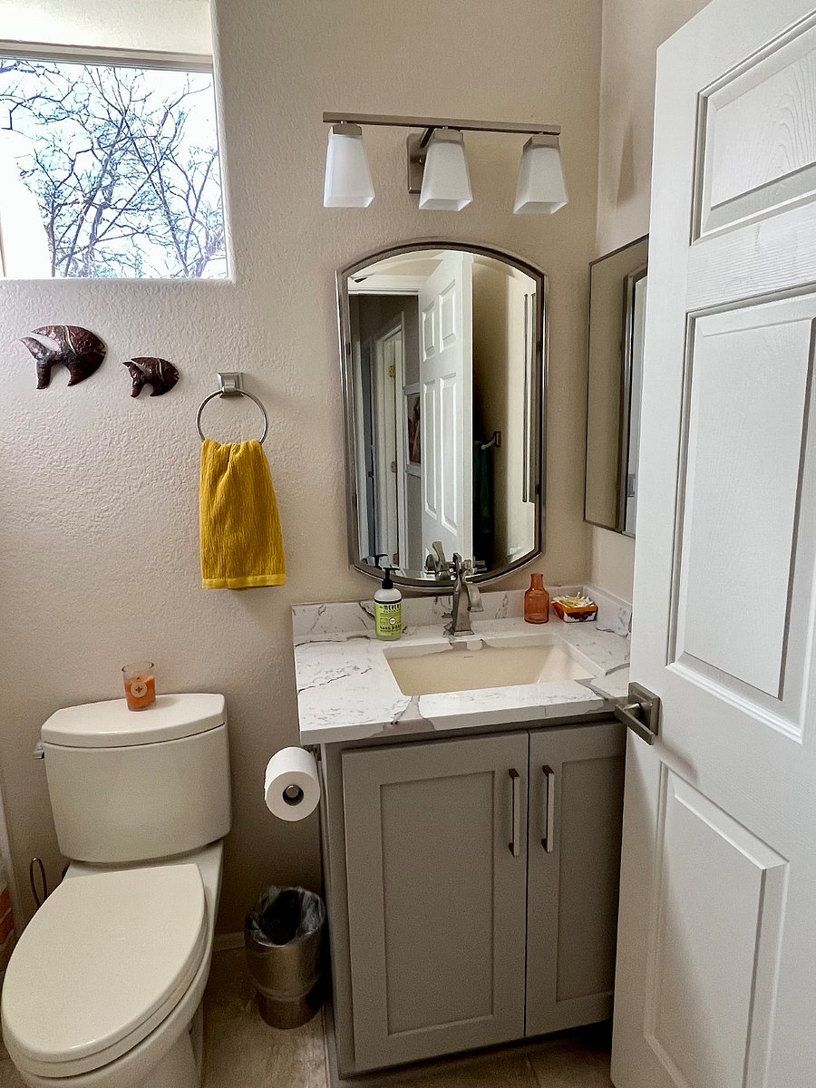 Guest bathroom with a shower and bathtub.