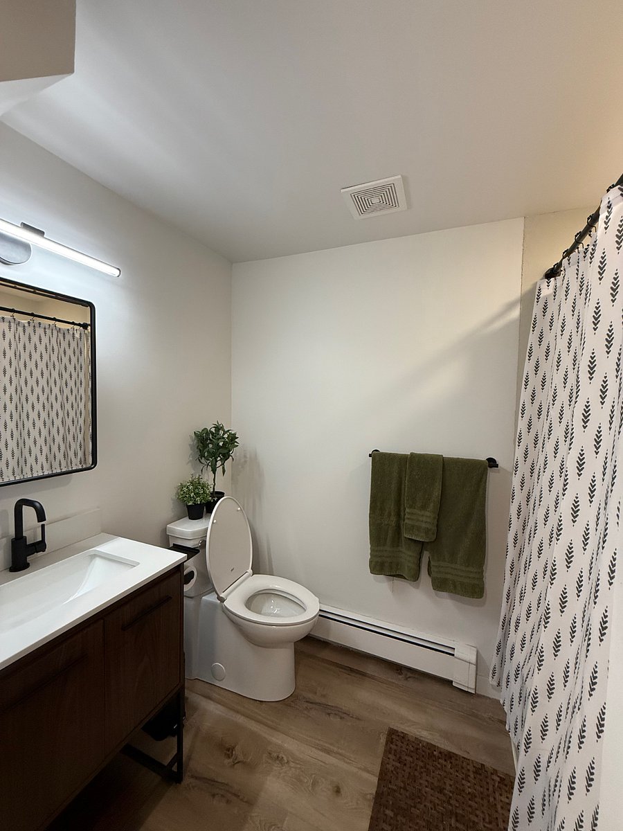 Lower Level 2nd bathroom. Directly across the hall from 2nd bedroom.