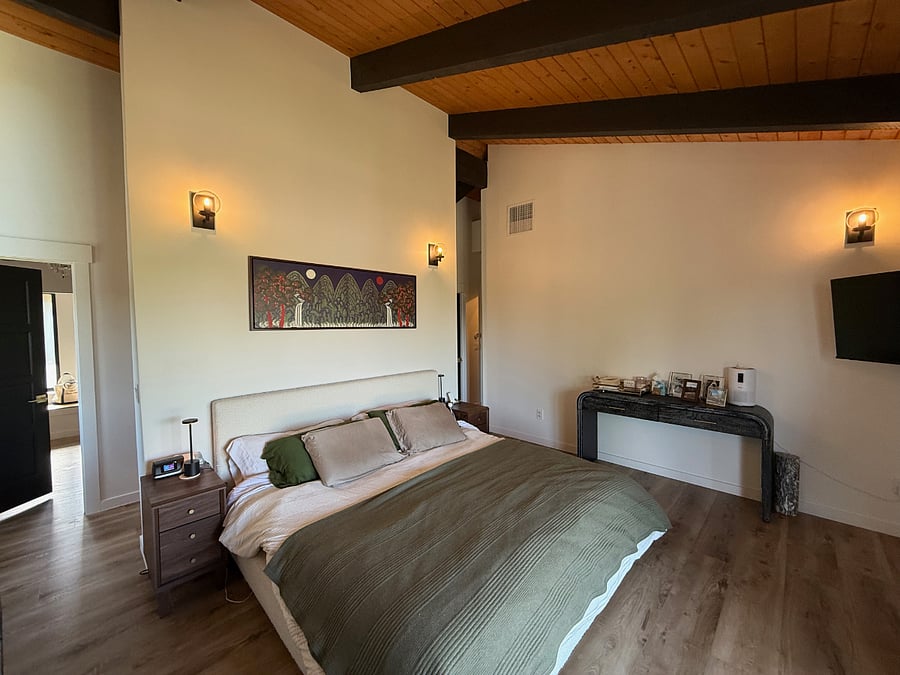 Bed in Primary Bedroom. Get restful sleep on this twin XL king so each side has its own mattress with recline controls.