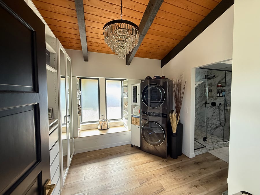 Walk in closet for the Primary Bedroom. Lots of mirrors and space as well as washer / dryer tower (theres another washer / dryer in the Lower Level in the Laundry room too).