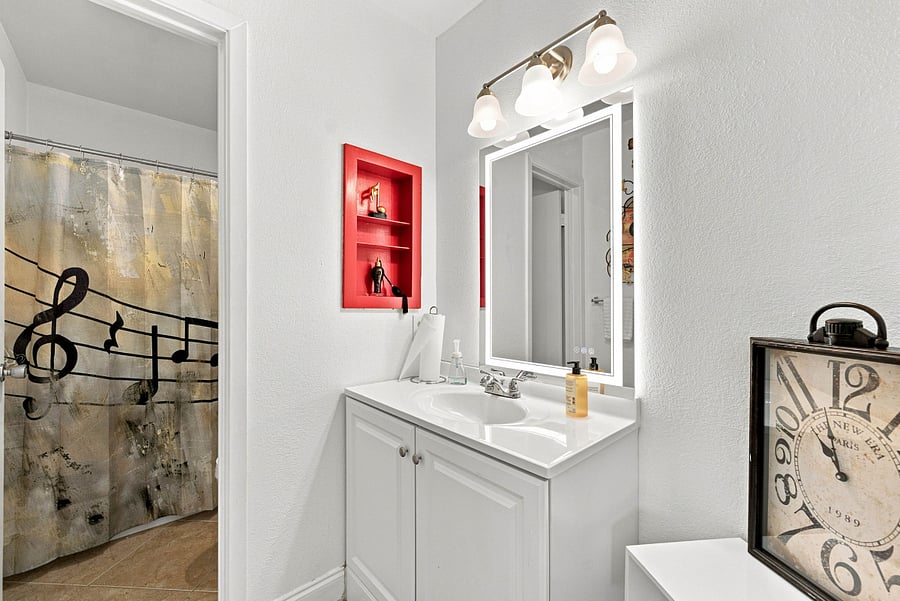 Master Bathroom with door that separates bathroom sink from toilet and shower.