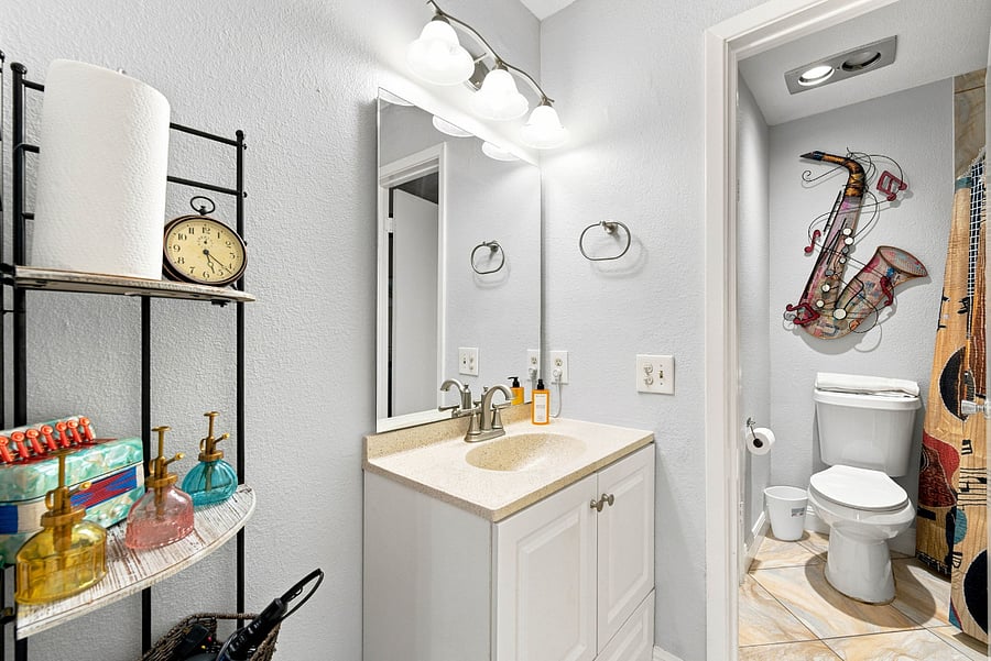 Shared Restroom with door that separates bathroom sink from toilet and shower.