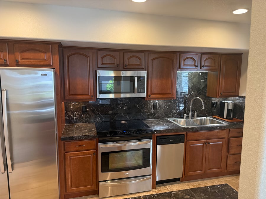 Full kitchen with appliances, complete set of cookware, dishes, silverware and linens.
