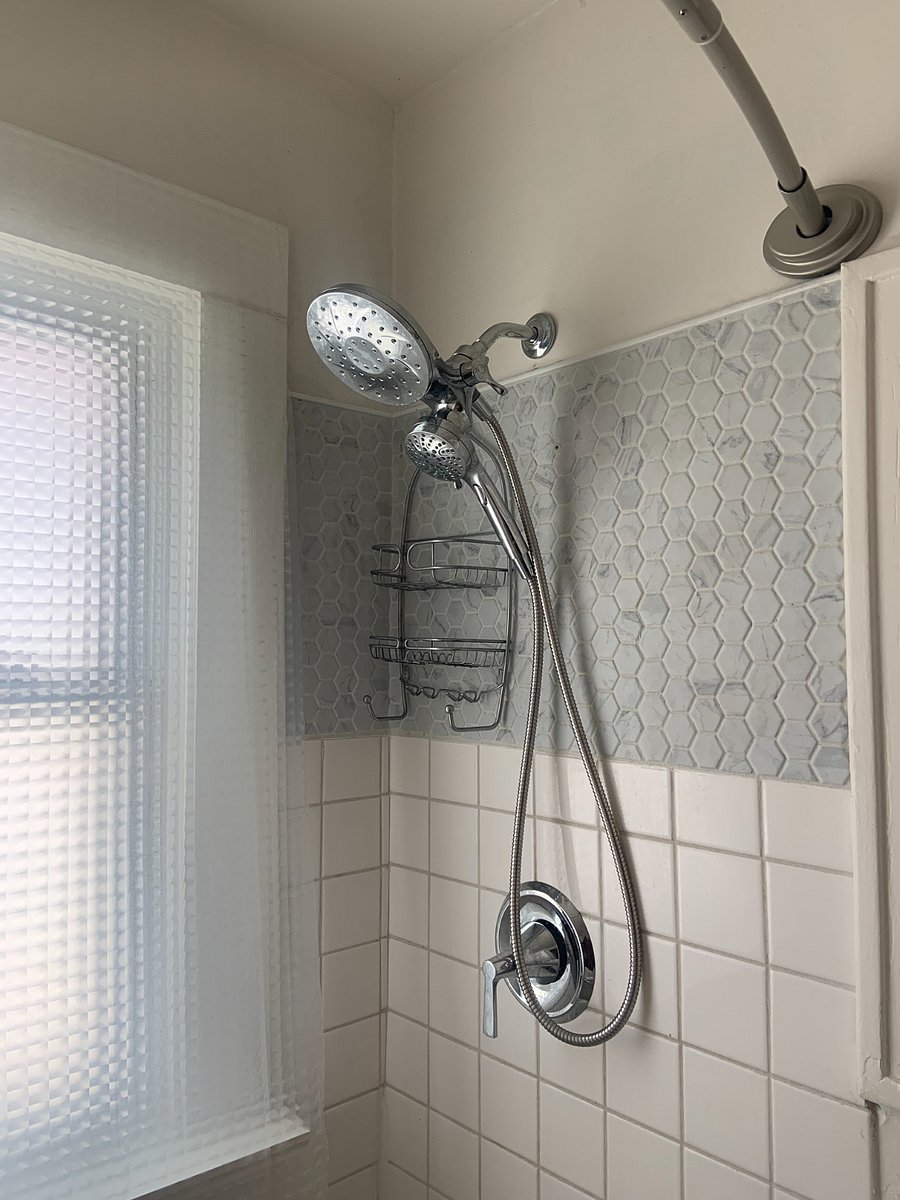 Shower has handheld wand