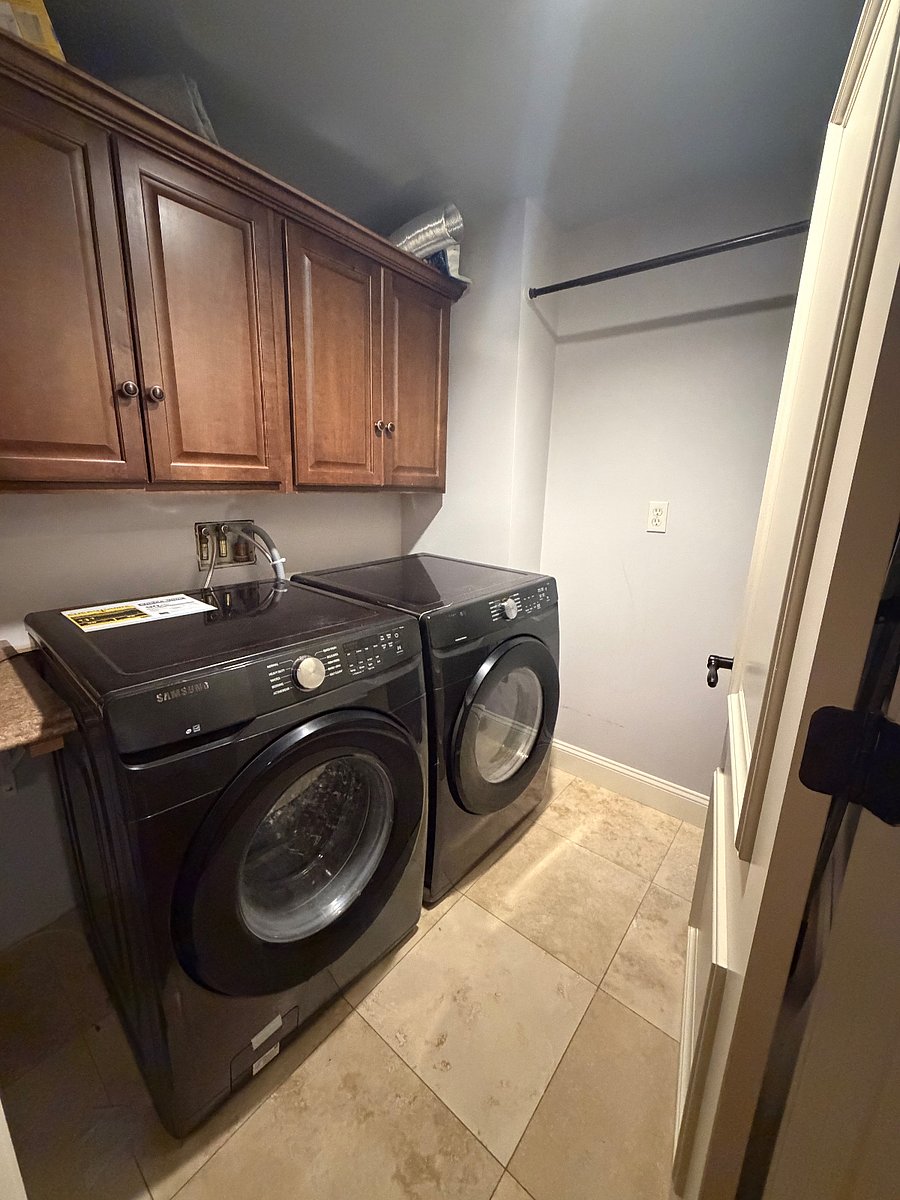 Front load washer and dryer in unit. Additional laundry on same floor. 