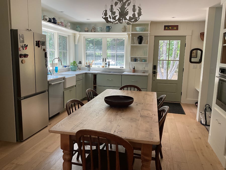 Fully equipped eat in kitchen with induction stovetop, wall oven, dishwasher, microwave, Keurig coffee maker, toaster oven,  French door refrigerator/freezer, pantry & farm sink.