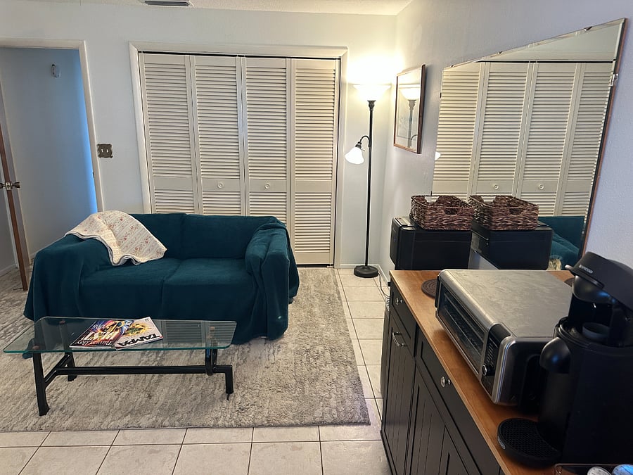 Couch, closets for storage...purified water.